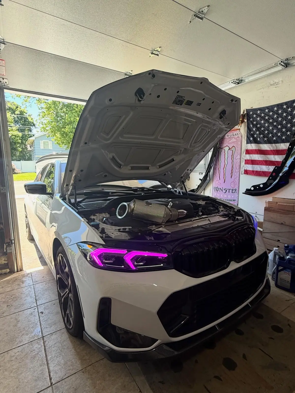 White BMW 3 Series with custom purple color-matched DRL headlights by Toro Performance