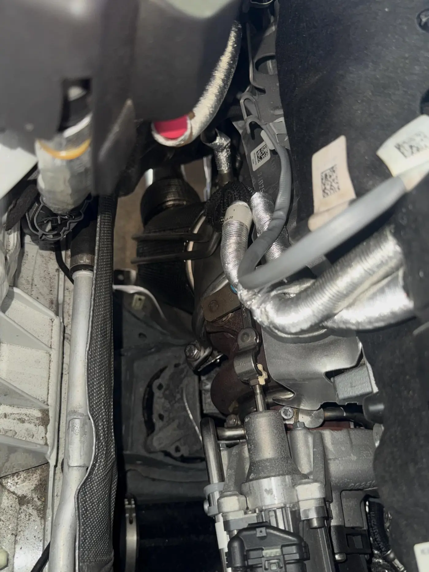 New downpipe installed, seen from underneath the BMW